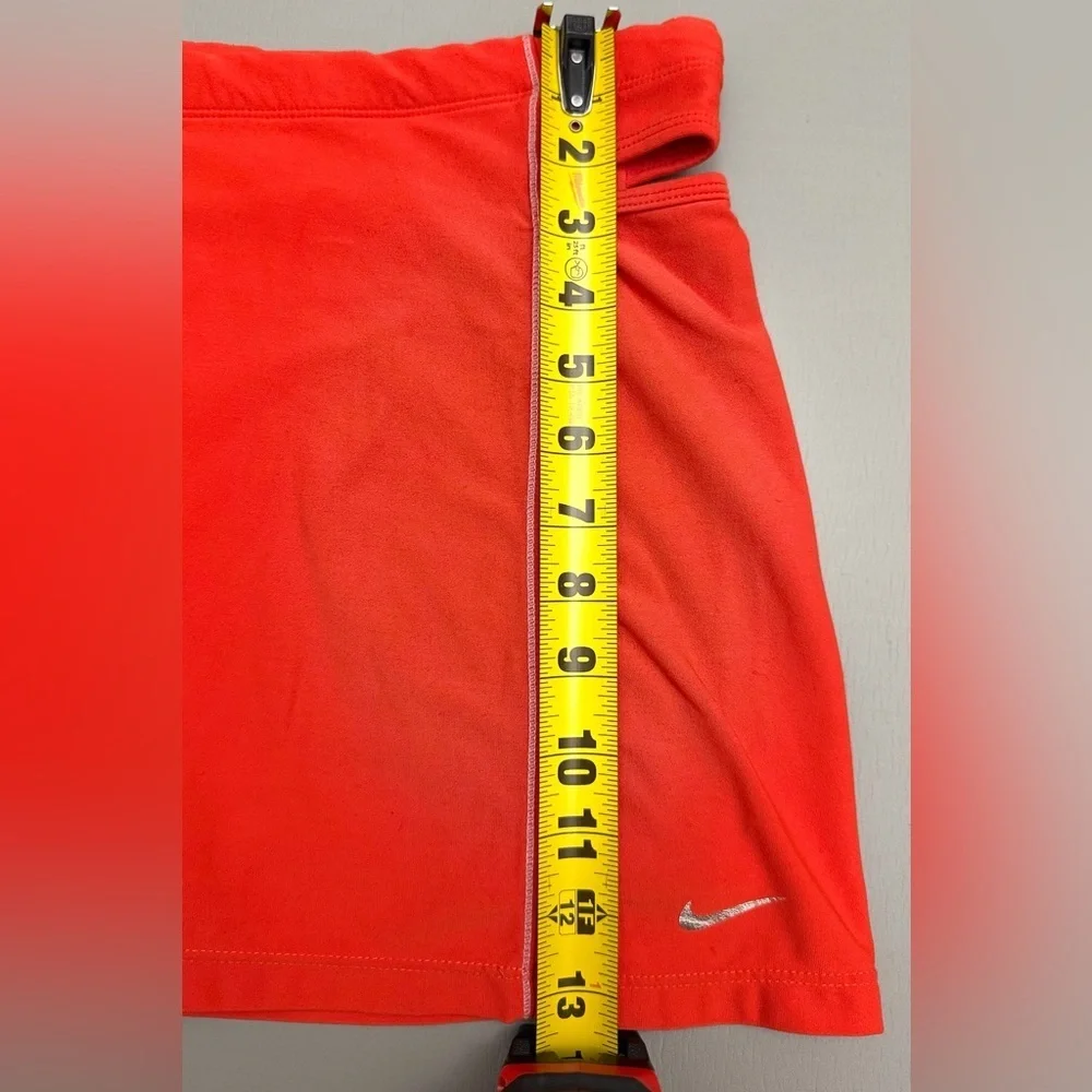 Nike red athletic skort featuring built-in compression shorts Size M